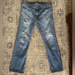 Levi’s 513 slim straight naturally distressed jeans